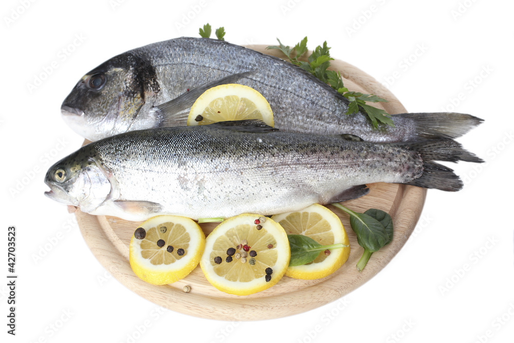 Fresh fishes with lemon, parsley and spice
