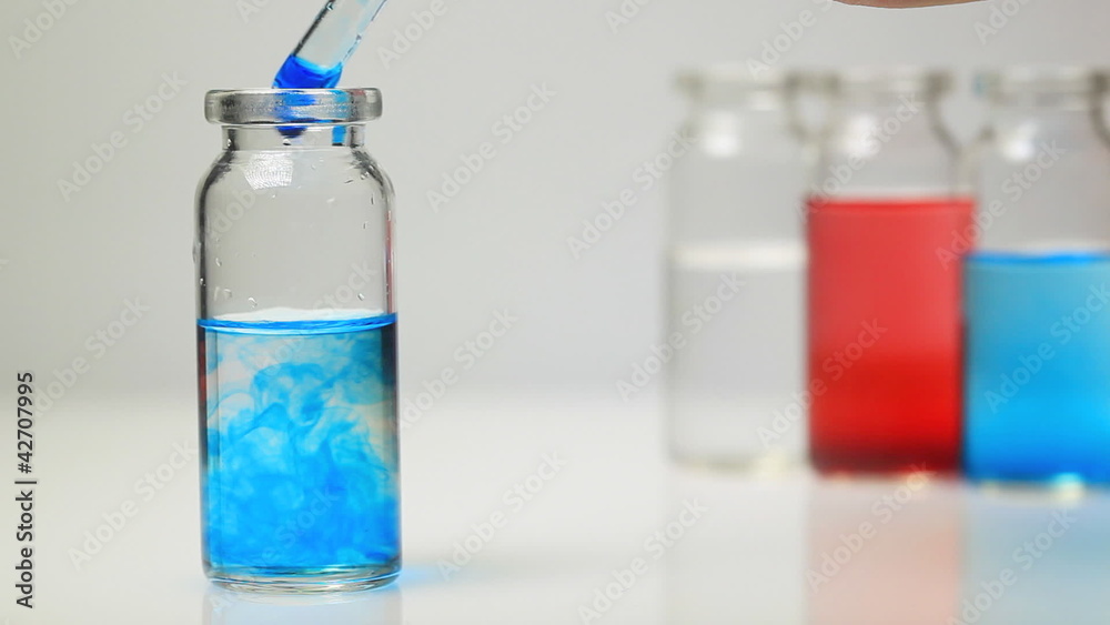 Researcher using a pipette, working in a lab Researcher using a pipette, working in a lab
