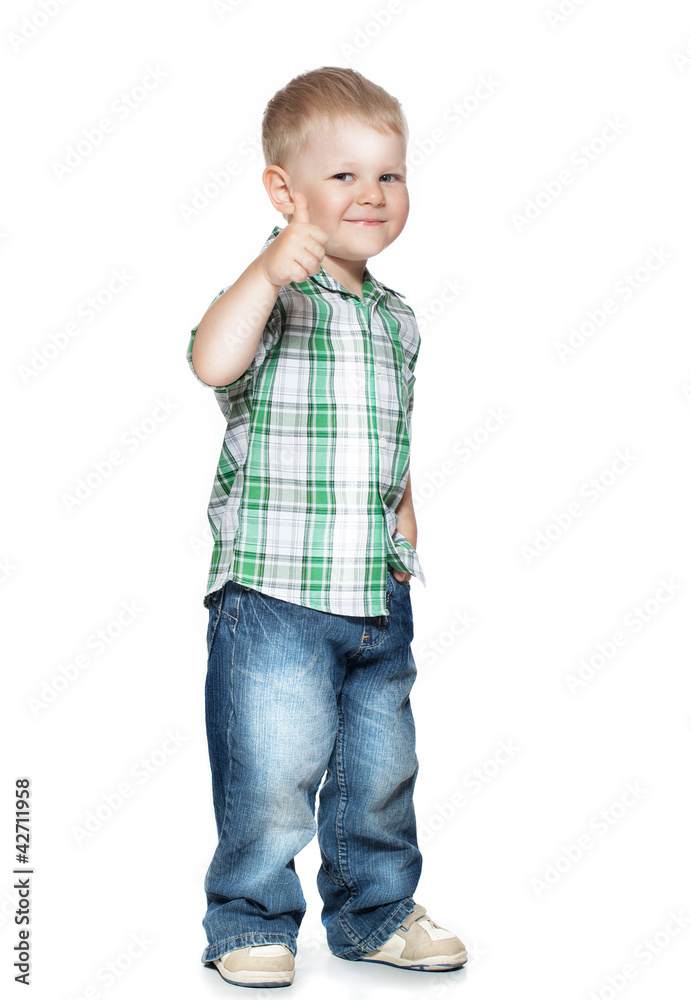 Portrait of beautiful little boy giving you thumbs up over white Portrait of beautiful little boy giving you thumbs up over white