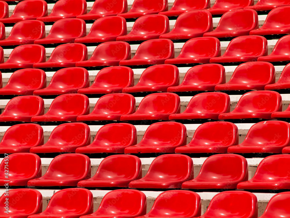Naklejka premium regular red seats in a stadium