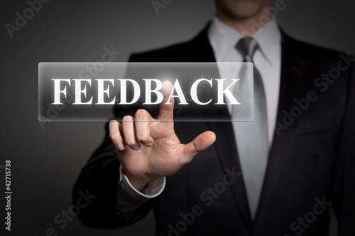 businessman pressing touchscreen button - feedback
