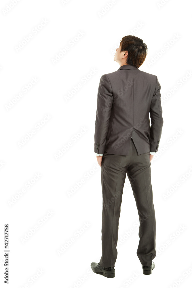 rear view businessman hand in the packet and looking up rear view businessman hand in the packet and looking up