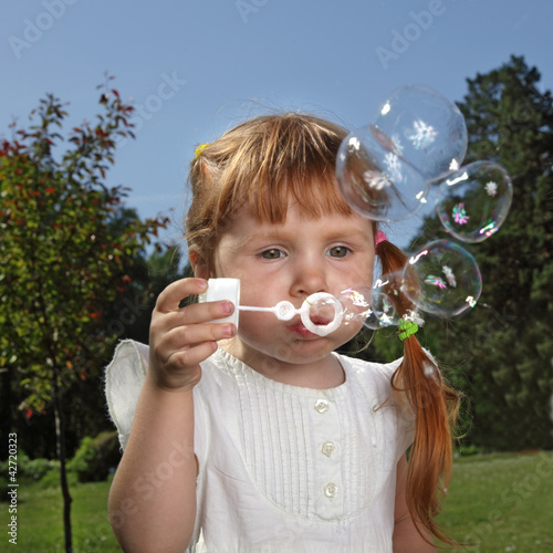 girl play in bubbles