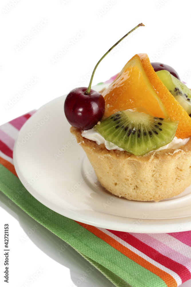 sweet cake with fruits on plate isolated on white sweet cake with fruits on plate isolated on white