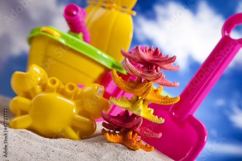  Colorful plastic toys on the beach 
