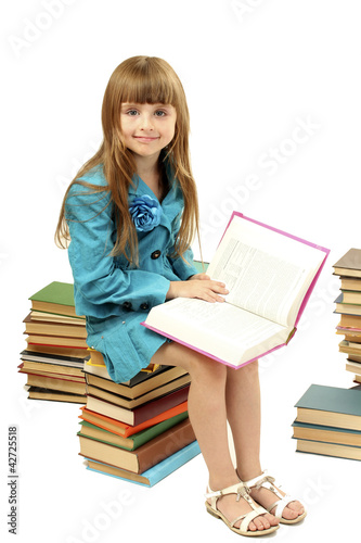 little girl with a books is...