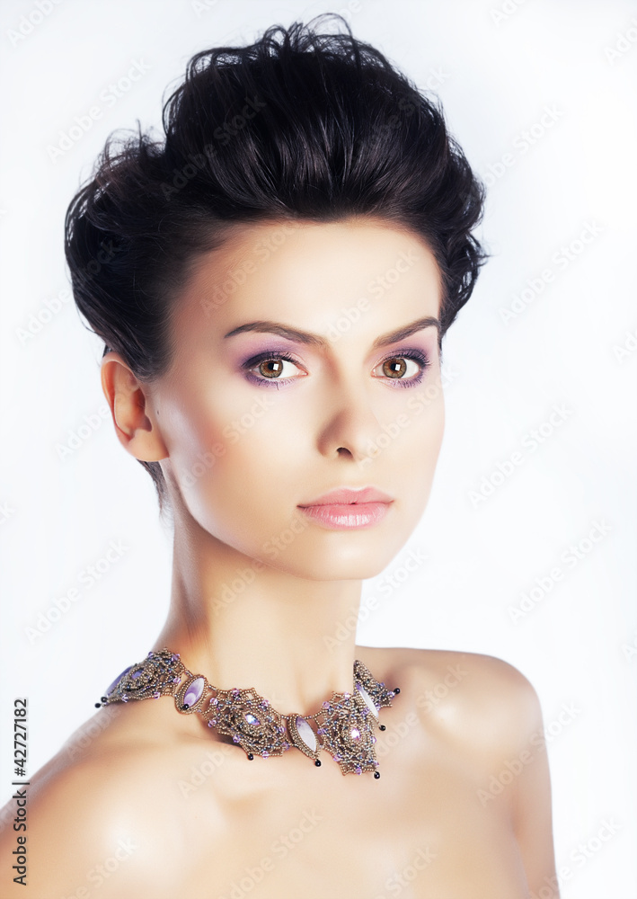 Beauty model with natural makeup, clean skin. White background
