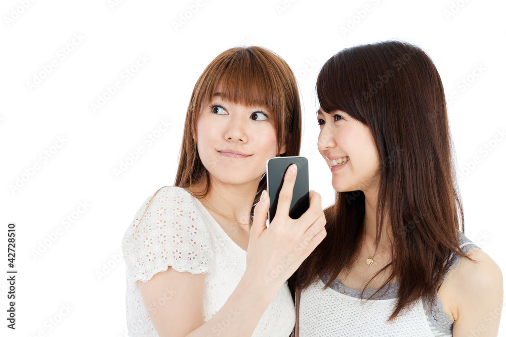 Beautiful young women using a mobile phone. Portrait of asian. Beautiful young women using a mobile phone. Portrait of asian.