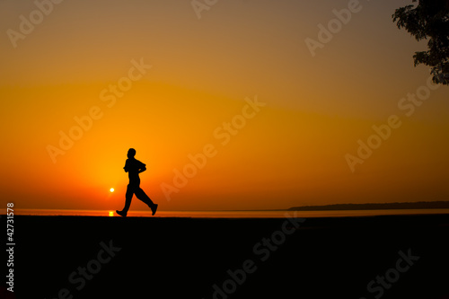 Silhouette man jogging