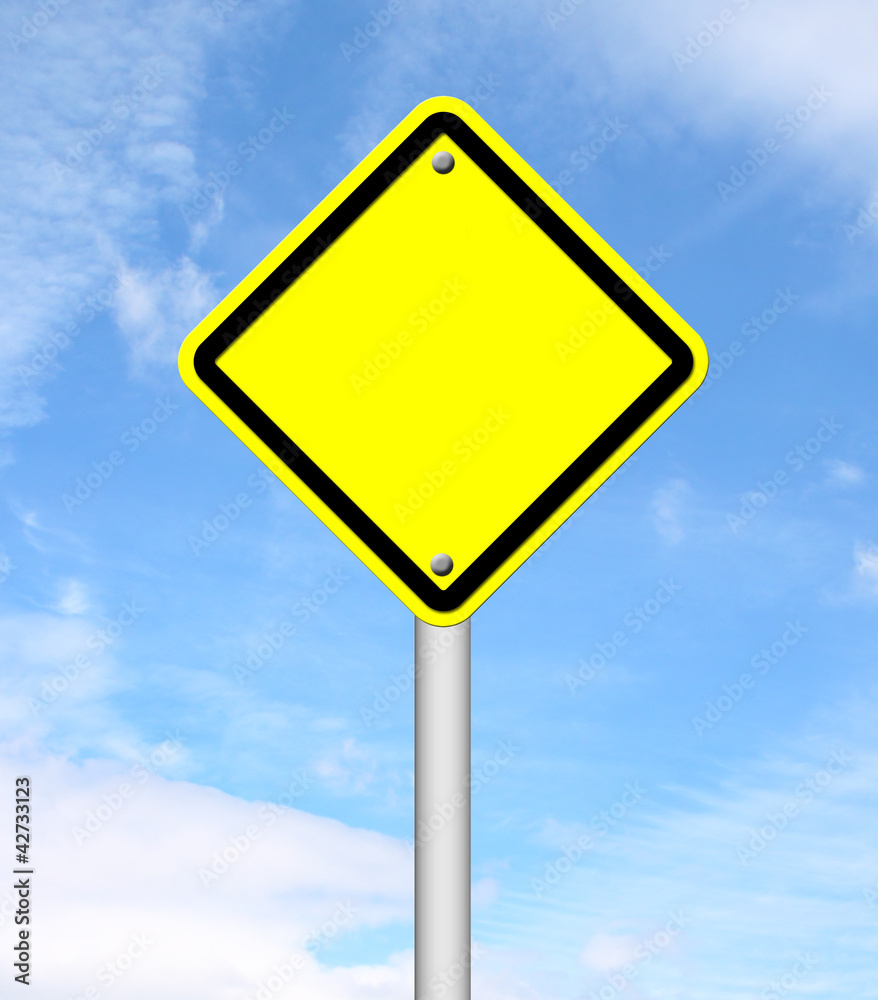 blank yellow traffic sign with blue sky