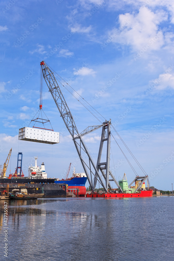 Heavy lifting floating crane vessel during operation.