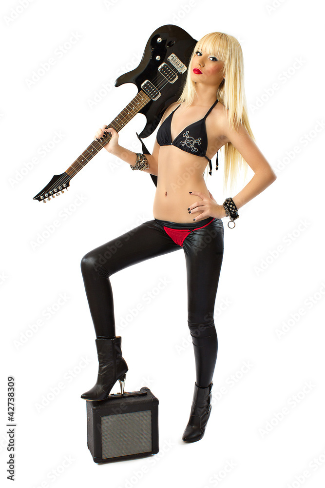 Sexy blonde woman in red thong posing with black electric guitar Sexy blonde woman in red thong posing with black electric guitar