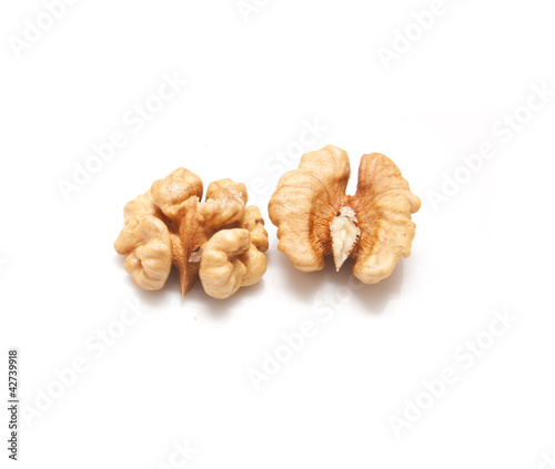 Crushed walnuts on white background