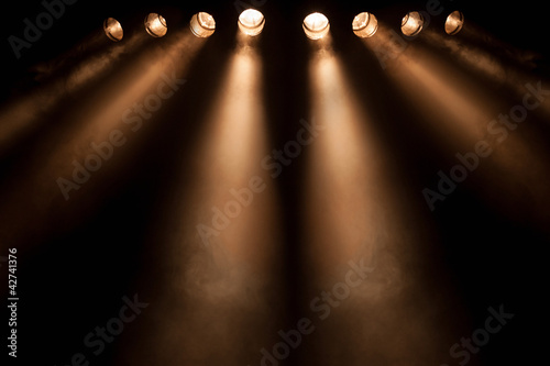 Eight divergent spotlights at night
