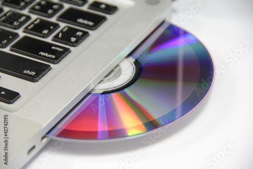 Obraz na płótnie cd or dvd disk in laptop w salonie