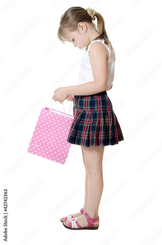 The little girl with a Pink package isolated The little girl with a Pink package isolated