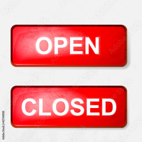 a sign of open and closed in red on a white background