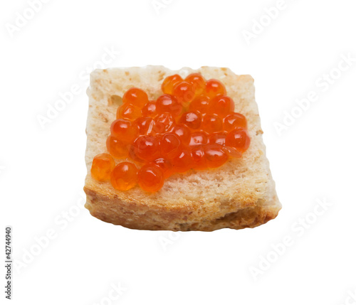 close-up red caviar on bread isolated on white background