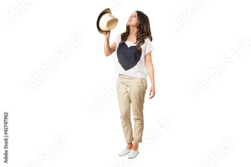 young fashionable brunette throwing a stylish hat © ibreakstock