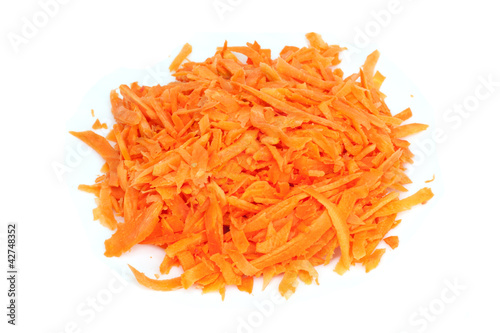 Pile of shredded carrots isolated on a white background
