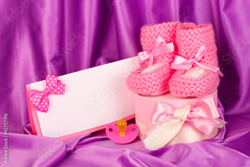 Fototapeta Naklejka Na Ścianę i Meble -  pink baby boots, pacifierd, postcard and gifts