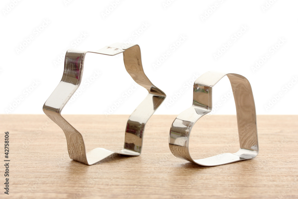 tins of cookies on wooden table on white background tins of cookies on wooden table on white background