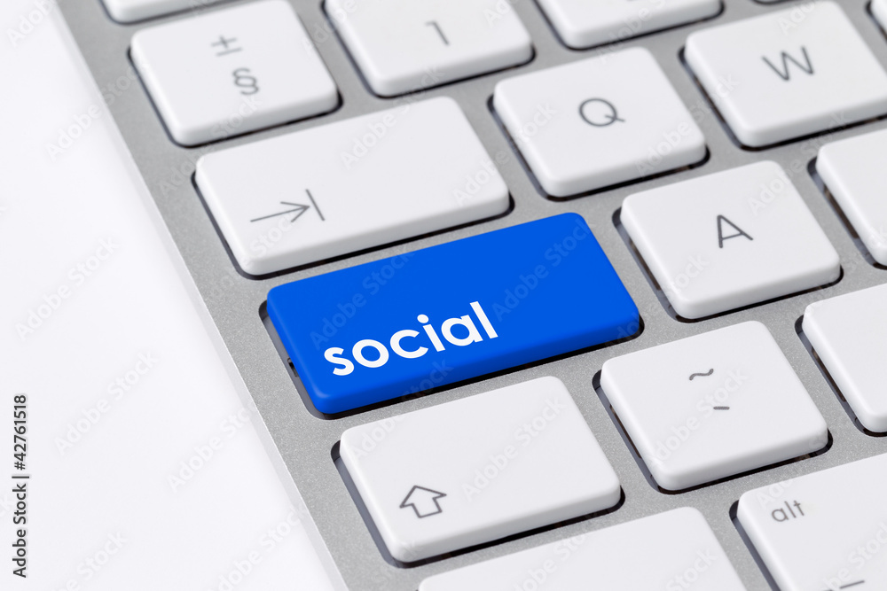 Keyboard with single blue button showing the word social Keyboard with single blue button showing the word social