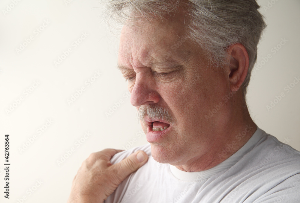 a man suffers from pain in his shoulder a man suffers from pain in his shoulder