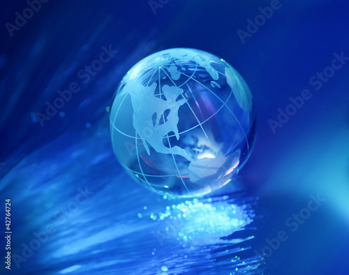 globe against fiber optic background