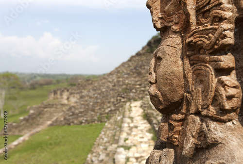 maya ruins in jungle, portrait of the God, Tonina in Mexico photo