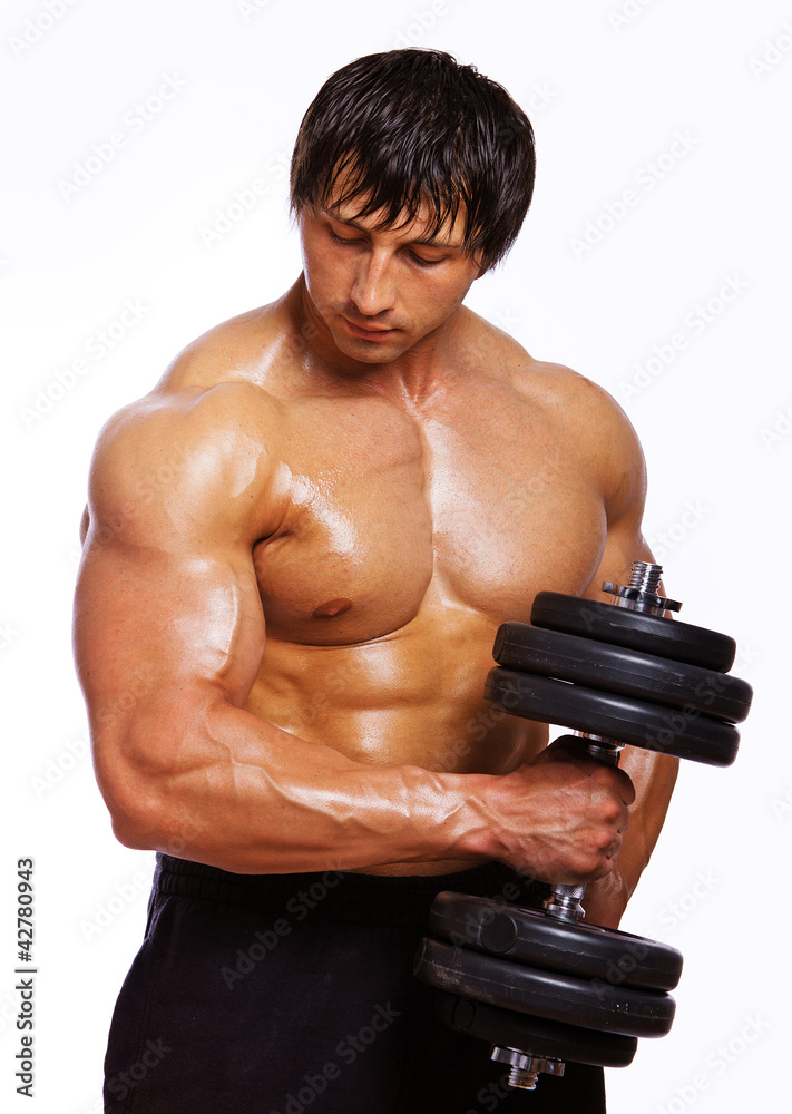 Portrait of muscle man doing exercises with dumbbells Portrait of muscle man doing exercises with dumbbells