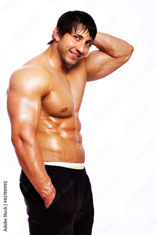 Portrait of muscle man on white background in studio Portrait of muscle man on white background in studio