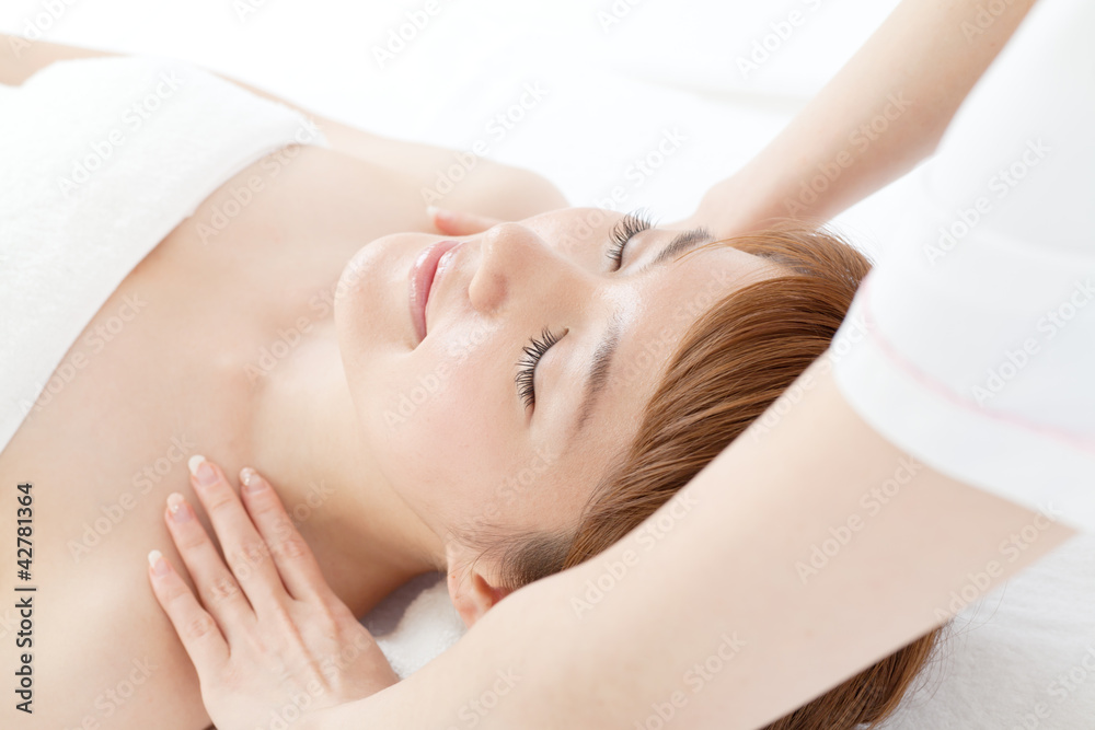 Beautiful young woman in spa. Portrait of asian.