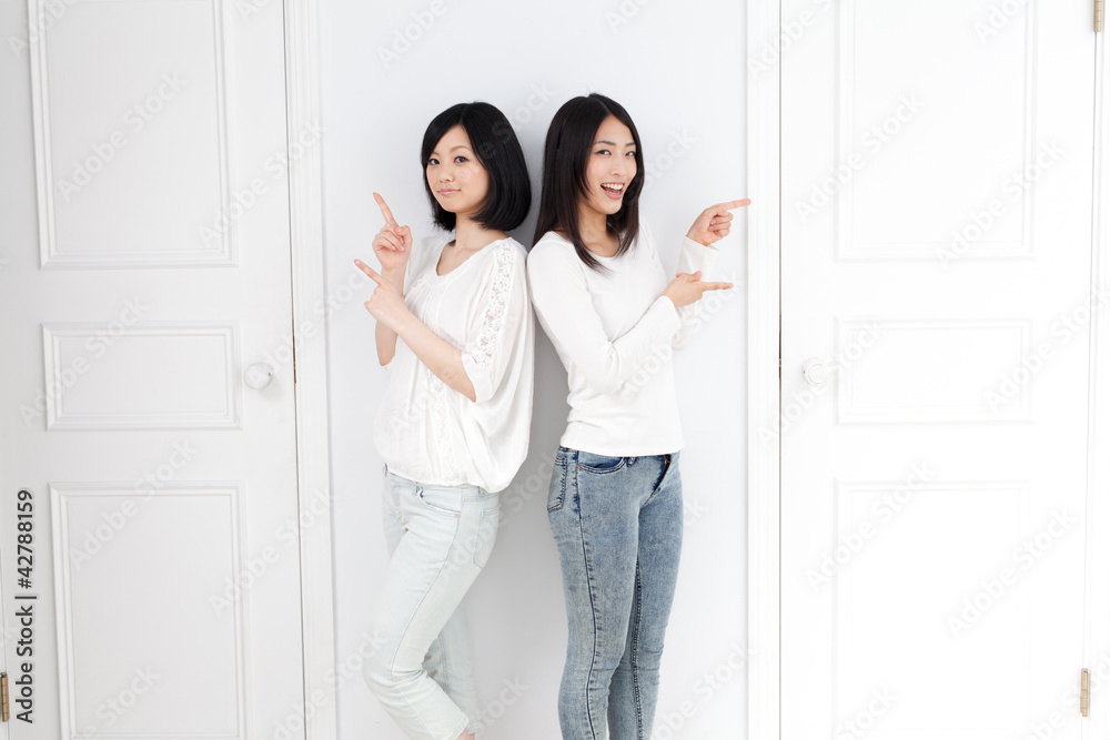 a young asian women with 2 doors a young asian women with 2 doors