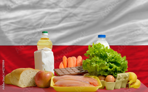 basic food groceries in front of poland national flag