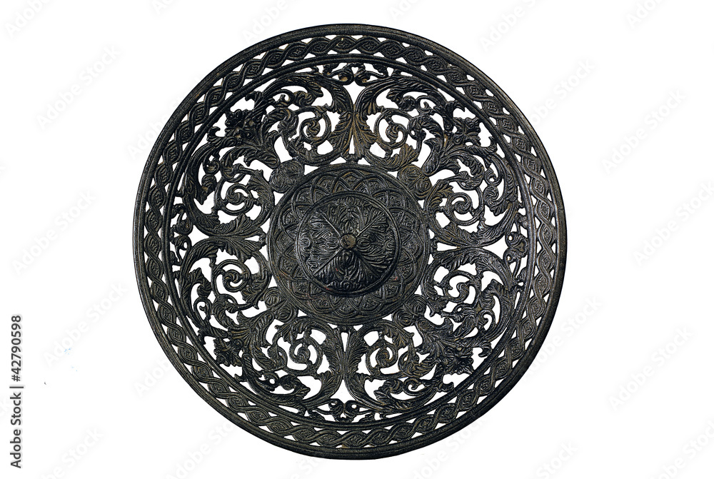 Ancient metal dish on a white background
