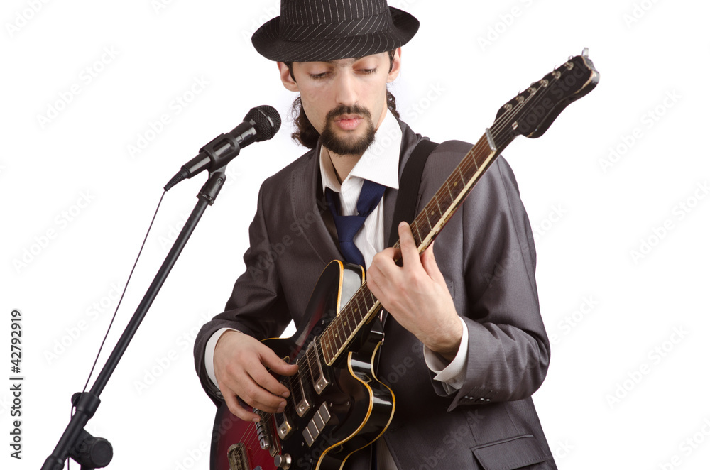 Businessman playing the guitar on white Businessman playing the guitar on white