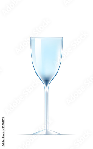 Empty glass of white wine on white background