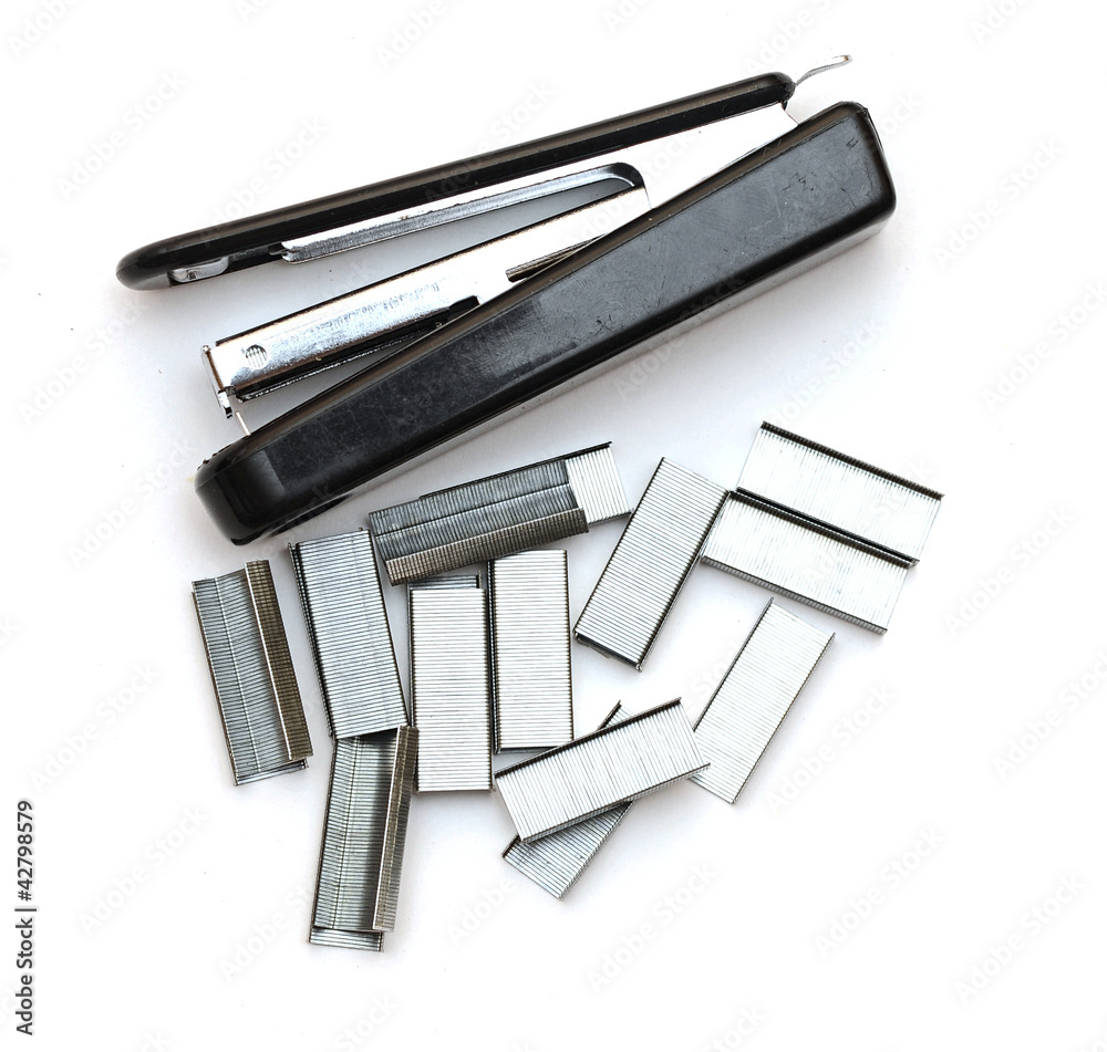 Black stapler and staples to him, isolated Black stapler and staples to him, isolated