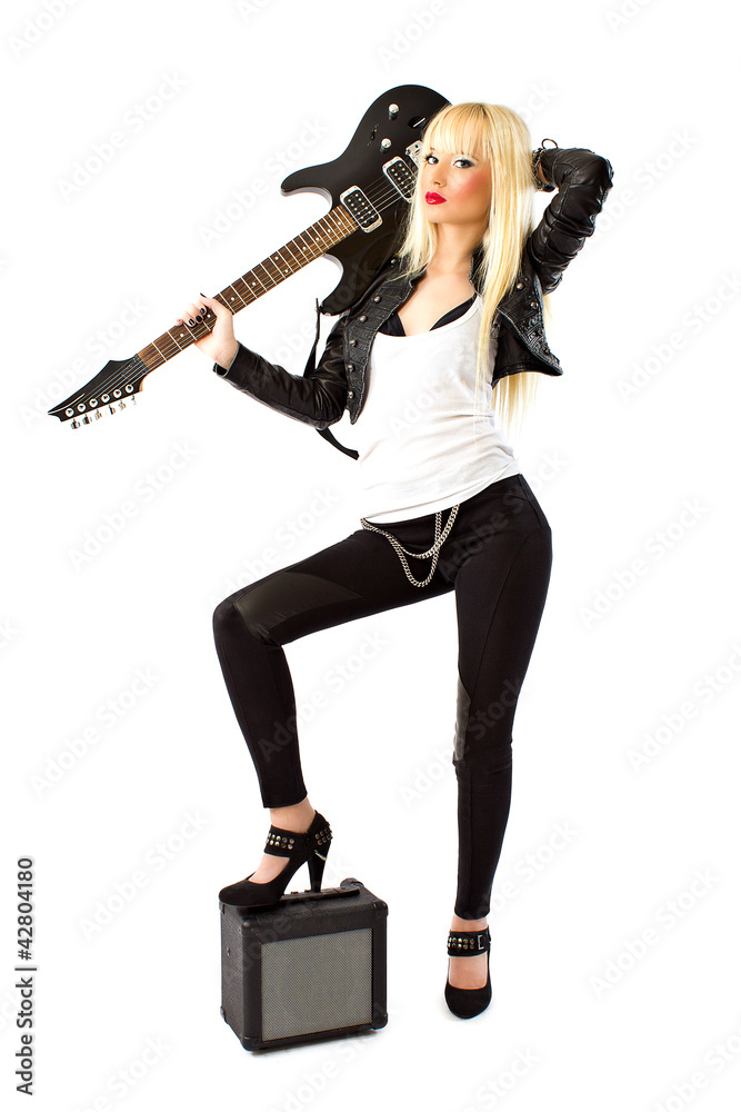 Sexy woman in black leather jacket posing with black guitar Sexy woman in black leather jacket posing with black guitar