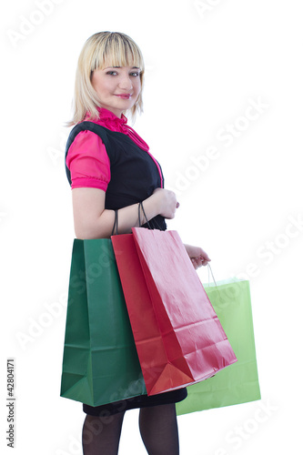 Portrait of stunning young woman holding shopping bags