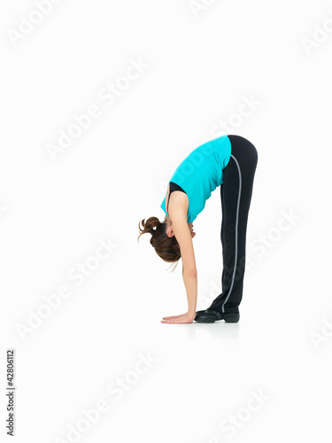 young woman showing fitness routine, white background