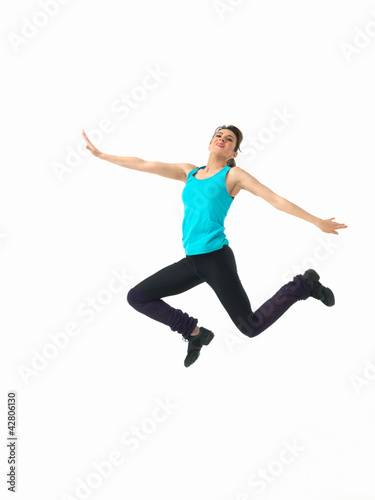 young woman showing fitness routine, white background © Daco