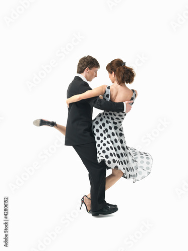young couple dancing the tango, white background