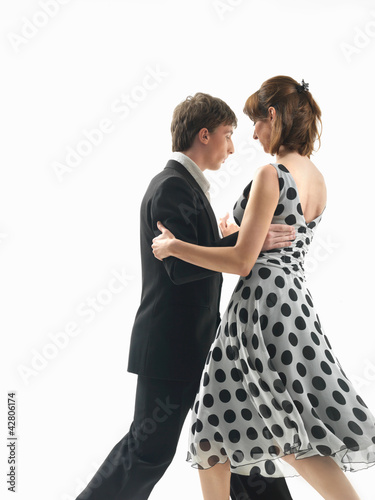young couple dancing the tango  white background