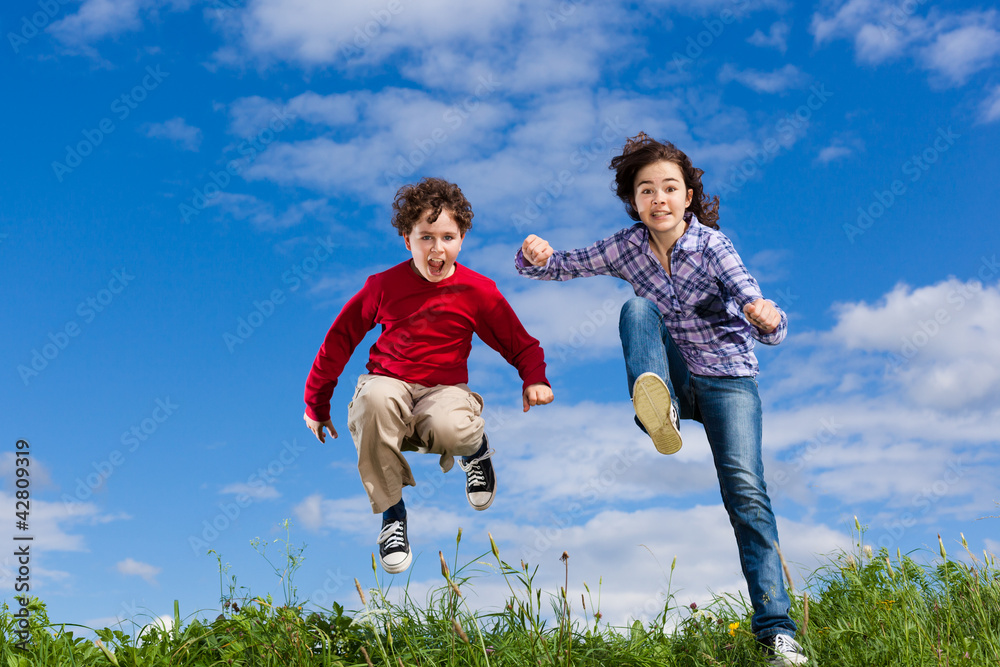 Girl and boy running, jumping outdoor Girl and boy running, jumping outdoor