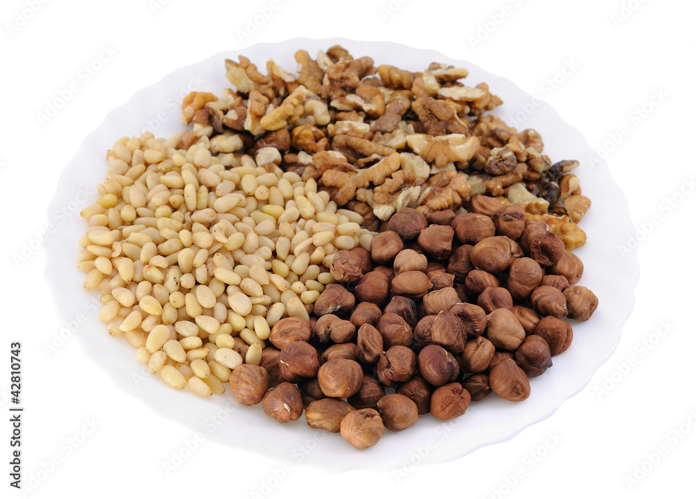 Nuts: hazelnut, walnut, cedar on white background Nuts: hazelnut, walnut, cedar on white background