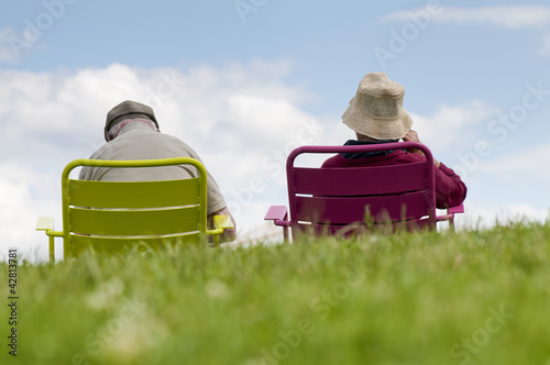 Senior couple relaxing in the park photo