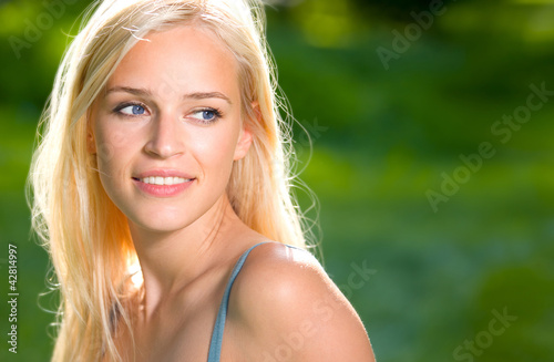 Smiling young beautiful woman, outdoors