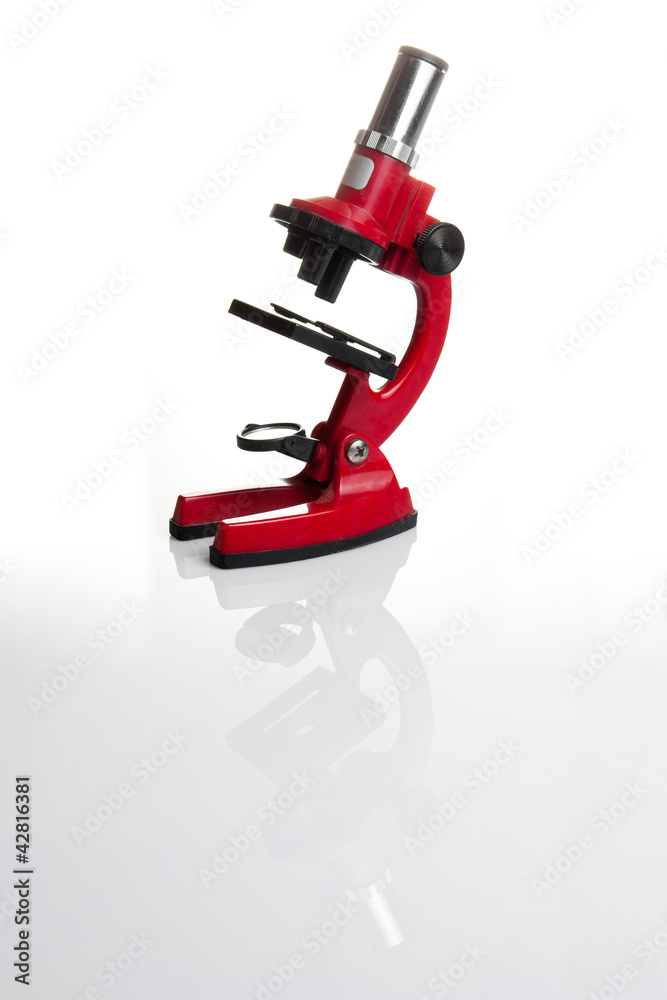 Red microscope isolated on white background Red microscope isolated on white background
